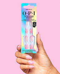 Hand holding OPI Sticking Point Check Tip Out instant no-glue press-on nails in iridescent packaging, showing pink checkered almond nails against a pink background.
