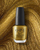 SaTURN Me On OPI nail polish bottle in metallic gold nail lacquer standing upright against a swirling gold glitter background, highlighting the shimmering, space-inspired shade for glamorous manicures.