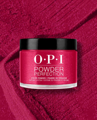 OPI It’s All Greek to Me dipping powder jar with black lid in a rich shimmery magenta shade, displayed on a matching textured powder background for bold fall nail colors.