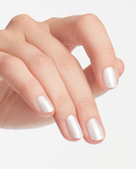 Fingernails display OPI Kyoto Pearl nail lacquer, a trending pearly white shimmer manicure on a hand posed against a clean white studio background.