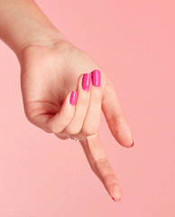 Glossy hot-pink nails coated in OPI No Turning Back From Pink Street nail lacquer, hand gracefully posed with curved fingers against a soft pink backdrop, highlighting spring nail colors and spring nail trends.