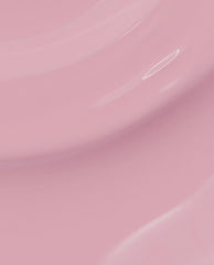 Glossy swirls of soft pastel pink (P)Ink on Canvas nail lacquer create smooth, curved layers, showcasing the creamy finish and color payoff of this OPI nail polish close-up.