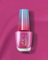 ASAPink RapiDry OPI nail polish gift set bottle standing upright, featuring iridescent rainbow logo and metallic pink shade with a blue-to-red gradient cap on a smooth magenta background, highlighting fast-dry manicure color.