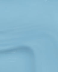 Close-up swatch of OPI Snap Your Fingers RapiDry™ in a smooth, glossy pastel blue finish, showcasing the nail polish texture and shine for an OPI nail polish gift set product detail shot.