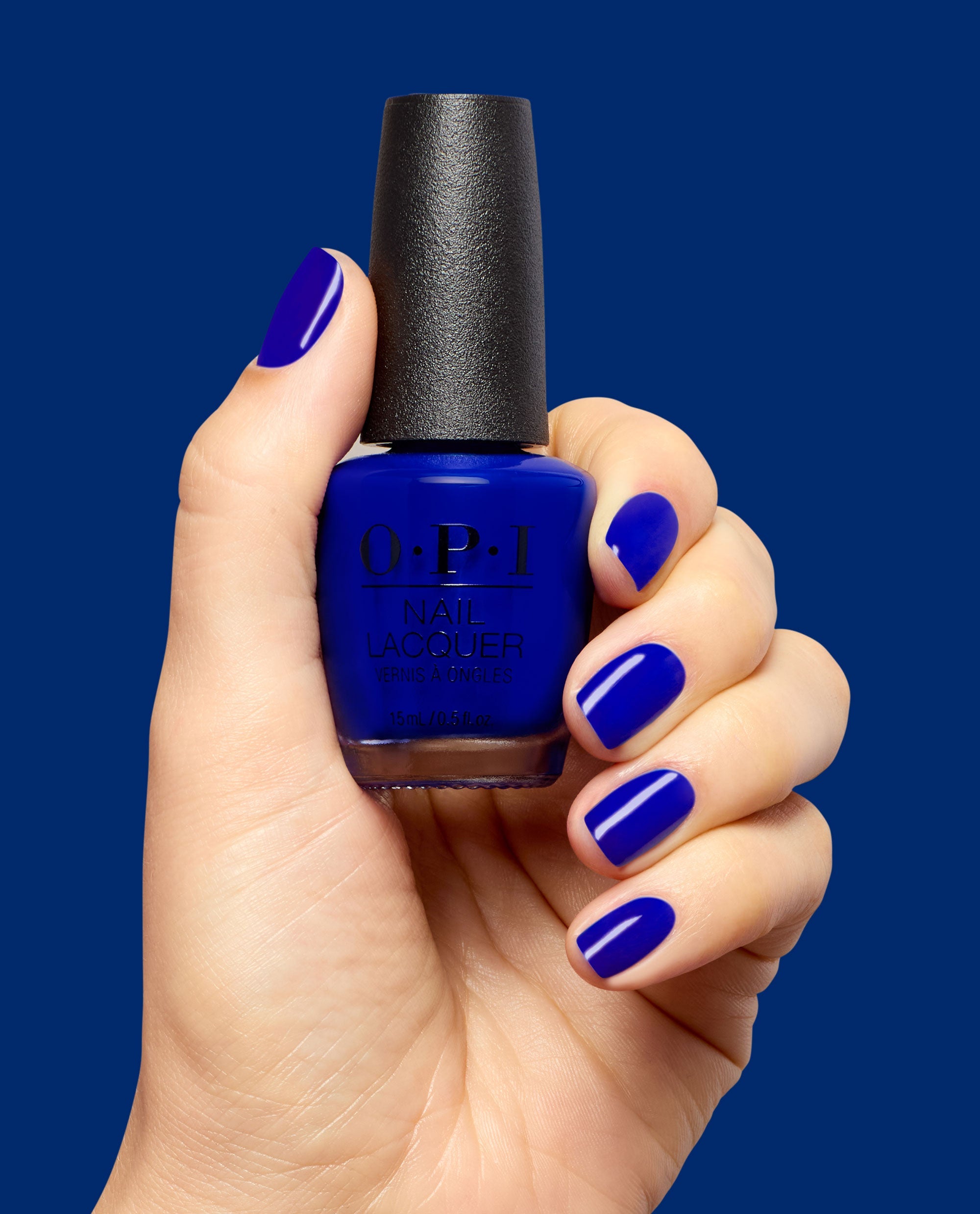 Catch a Wave of Happiness Royal Blue Nail Polish Hand and Product