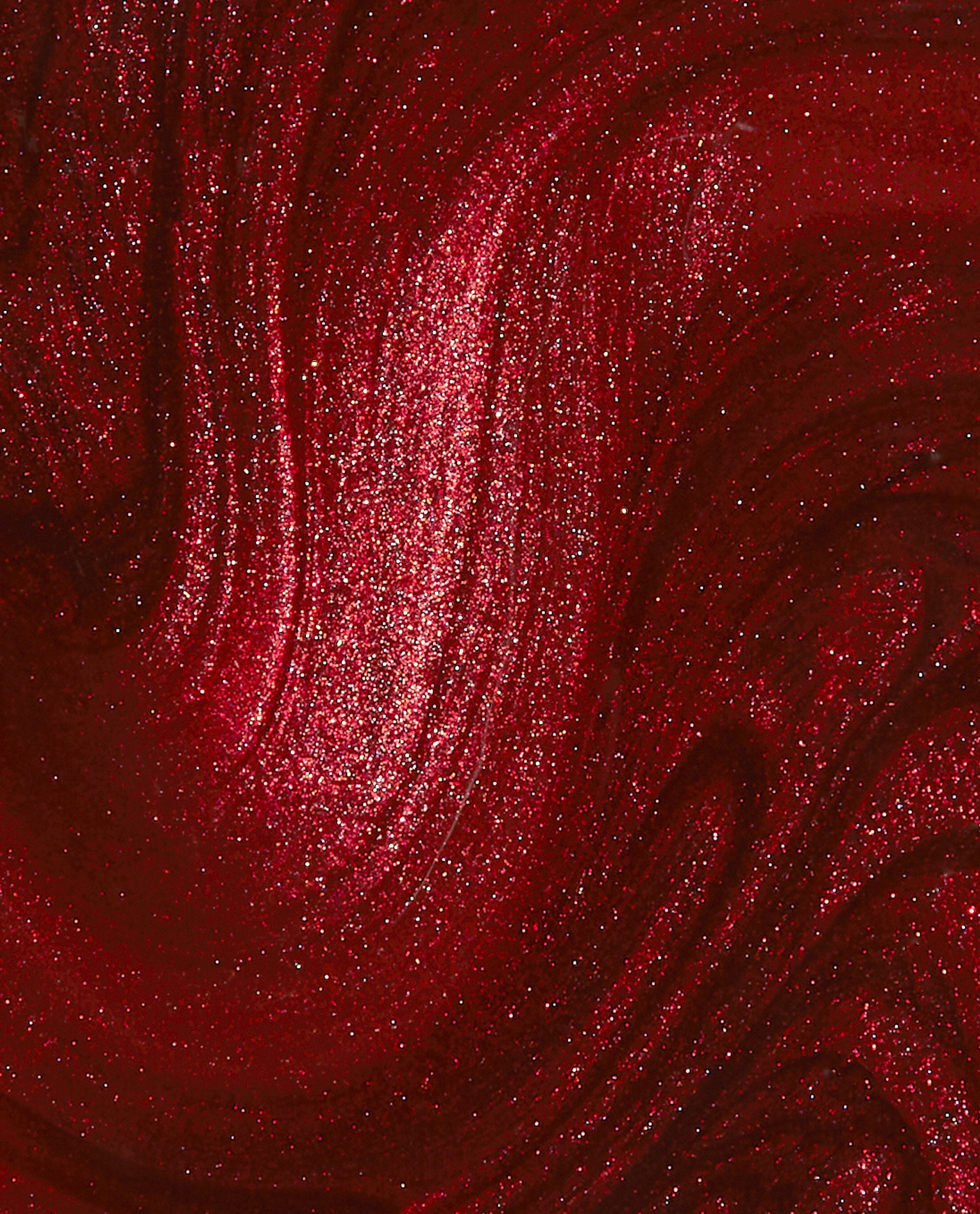 CD Rom-antic OPI nail polish nail lacquer swatch shows deep crimson red color with shimmering metallic glitter and swirling, glossy texture, highlighting its rich, romantic finish for manicures and pedicures.
