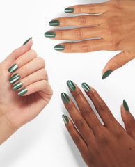 Hands model OPI Feelin’ Capricorn-y xPRESS/ON press-on nails in metallic forest green shimmer, shown in rounded and almond shapes on a clean white background.