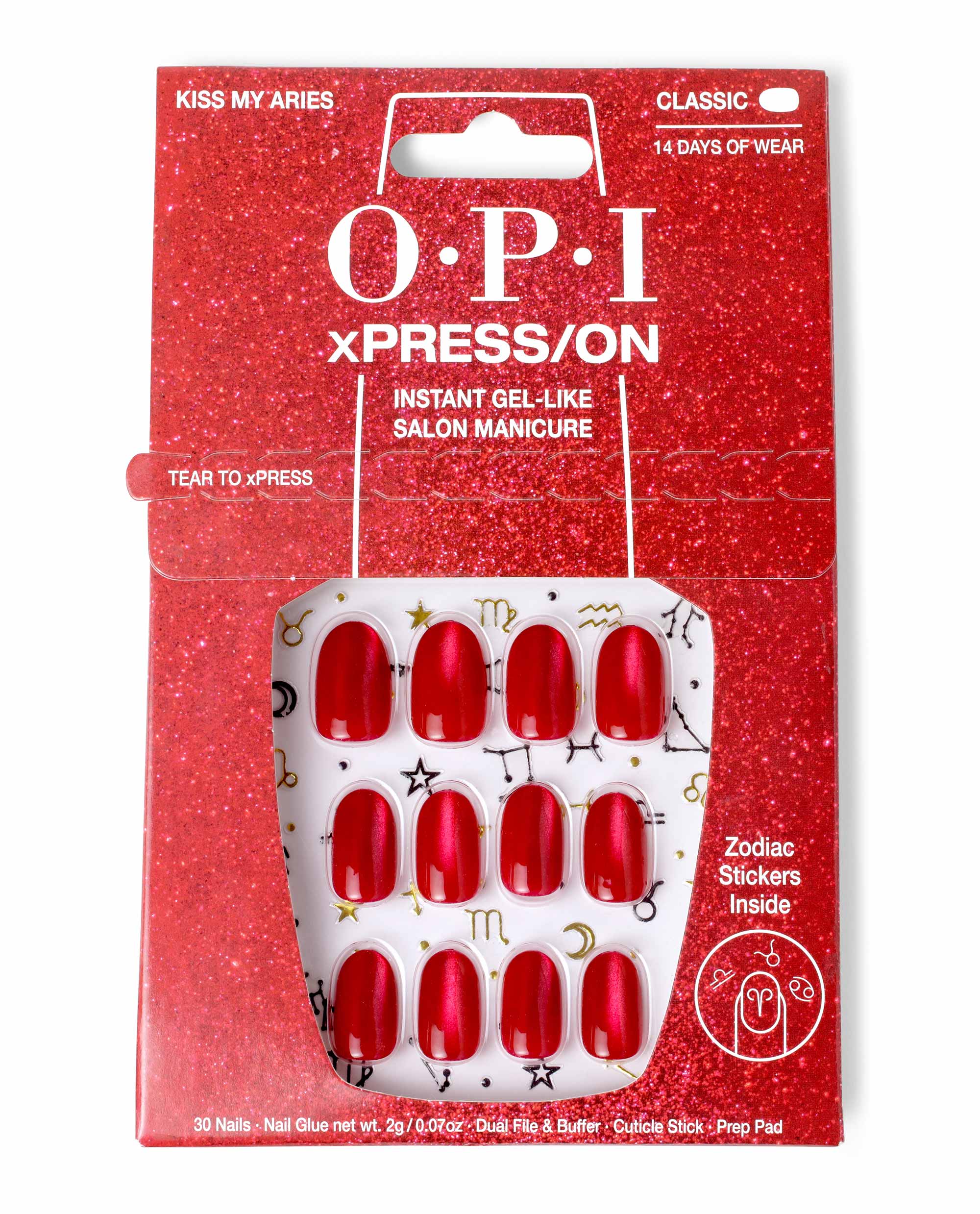 Kiss My Aries xPRESS/ON Effects red press-on nails displayed in glittery red OPI nail polish–themed packaging, featuring 30 glossy red nails with gold zodiac symbols and text promising instant gel-like salon manicure and zodiac stickers inside.