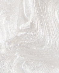 Kyoto Pearl OPI nail lacquer swatch shows a sheer pearly white shimmer with fine iridescent sparkle and brush-stroke texture, a trending soft neutral manicure shade.