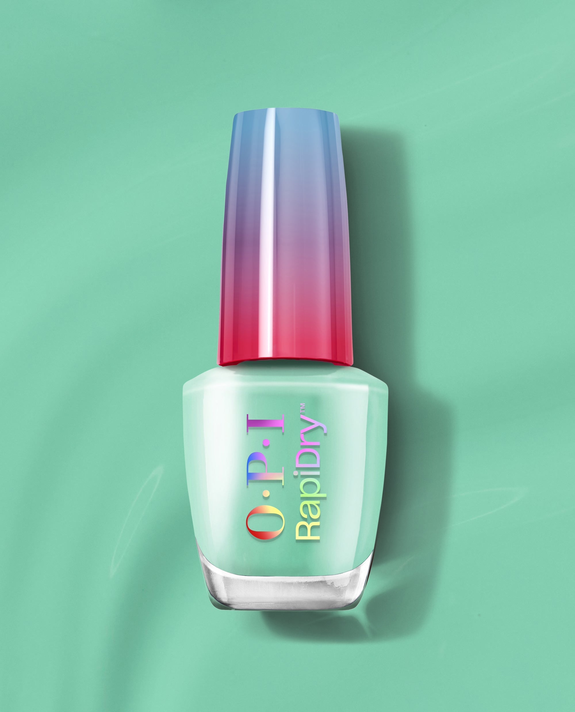 OPI RapiDry™ No Further Delays bottle stands upright, showcasing soft mint green nail polish with a blue-to-pink gradient cap on a matching green backdrop—a fresh pick for green nail polish lovers seeking spring nail colors from OPI.