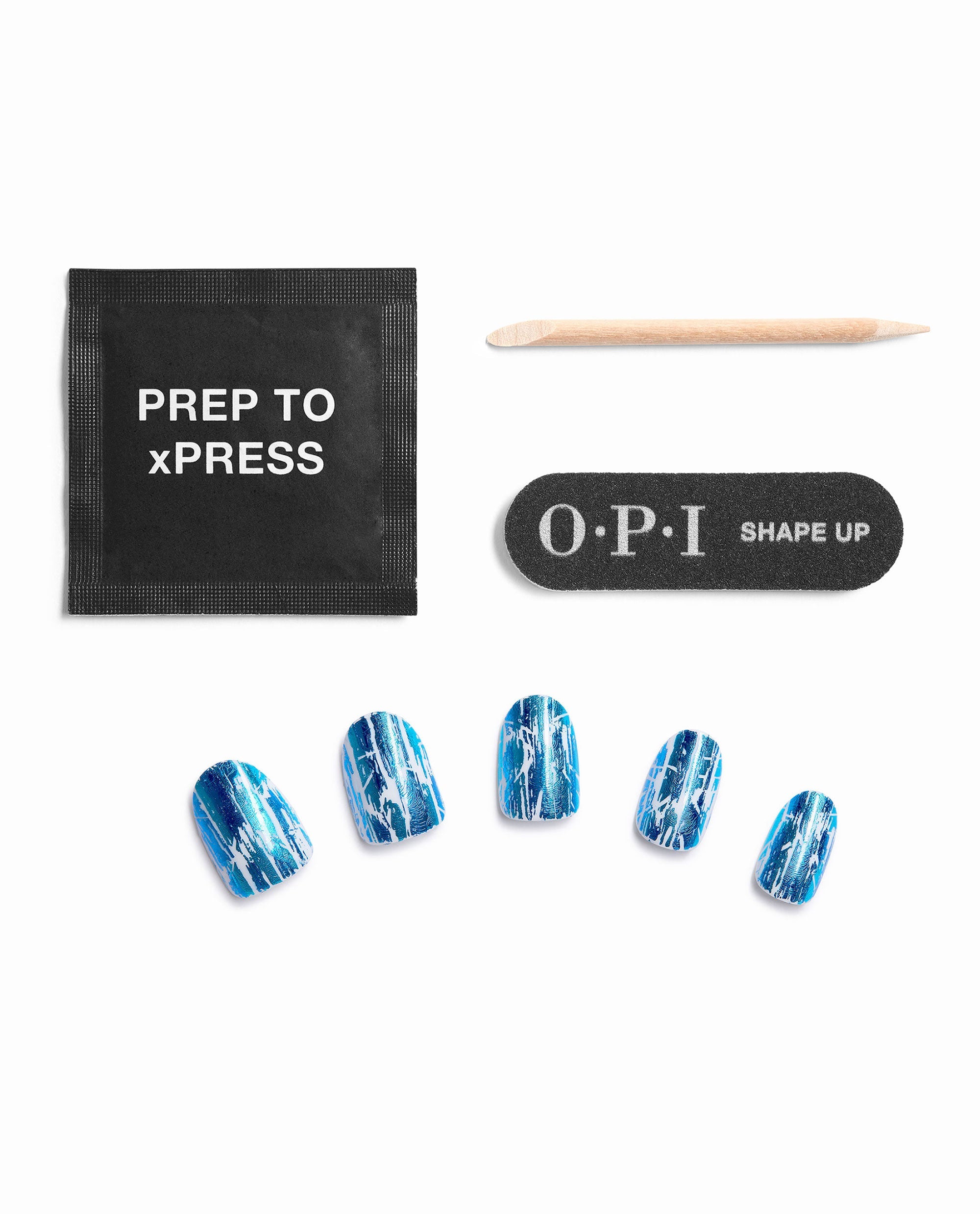 Snap, Crackle, Gloss Sticking Point press-on nail kit displays blue-and-white crackle artificial nails with OPI Shape Up file, wooden cuticle stick, and Prep to xPress pad on a white background, ideal for OPI fall nail colors.
