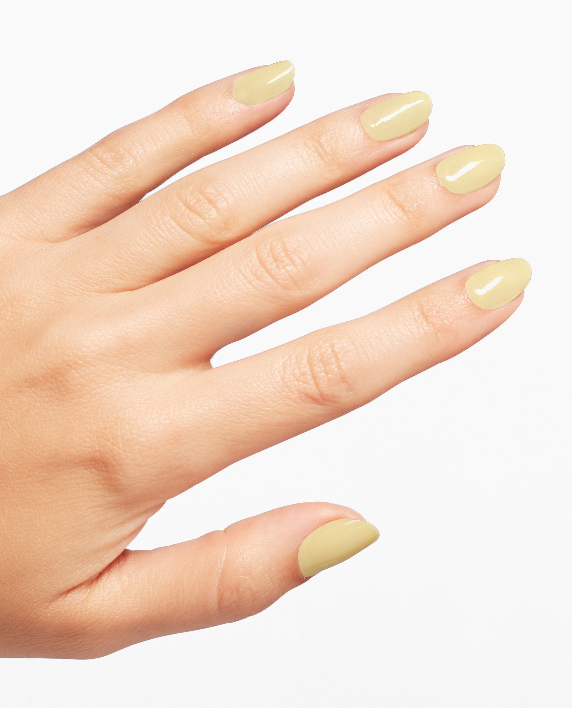 Hand displays glossy almond-shaped nails painted with OPI Buttafly yellow Nail Lacquer against a clean white background.