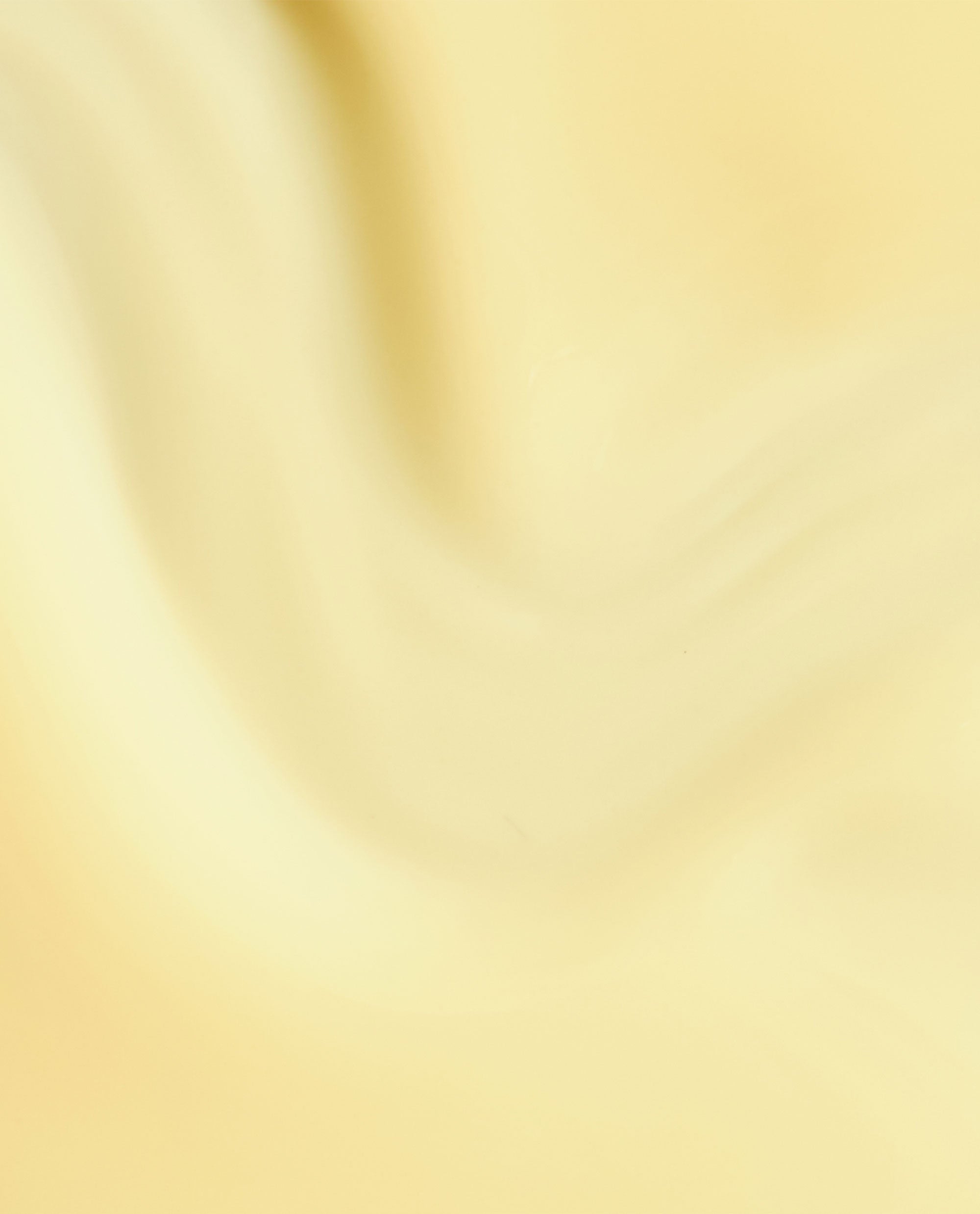 Sunny Bunny OPI nail lacquer swatch showing a soft pastel yellow polish with a smooth, glossy cream finish on a close-up nail color sample background.