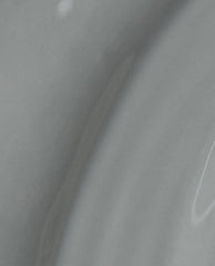 Suzi Talks with Her Hands OPI nail polish nail lacquer shown in a close-up brush swatch, displaying smooth, glossy medium-gray color with subtle streaks and shine across the liquid surface.