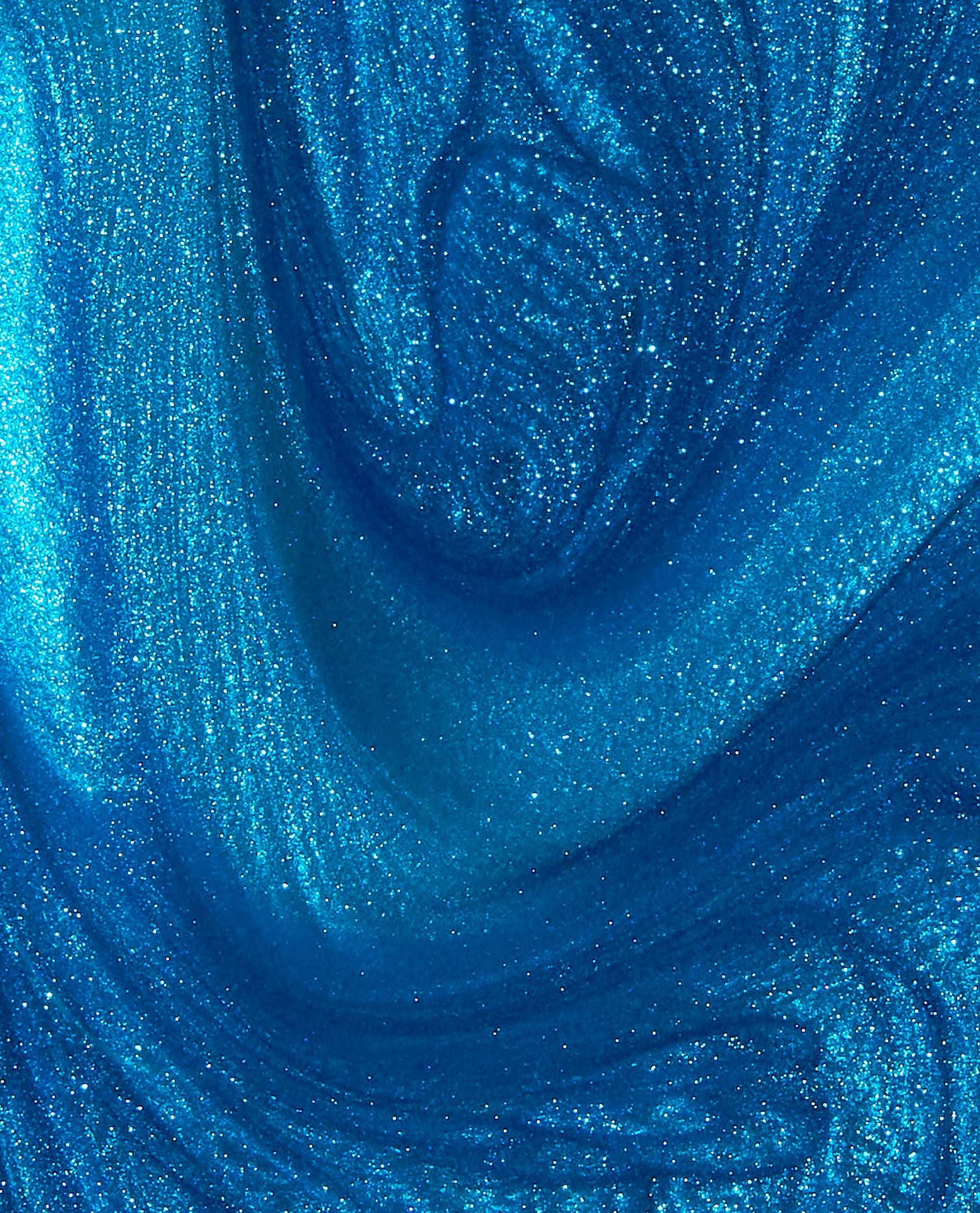 Shimmering electric blue Y2Slay nail lacquer, resembling swirling metallic waves, showcases fine glitter and high-shine finish, highlighting the vibrant color payoff and glossy texture of this OPI nail polish-inspired shade.